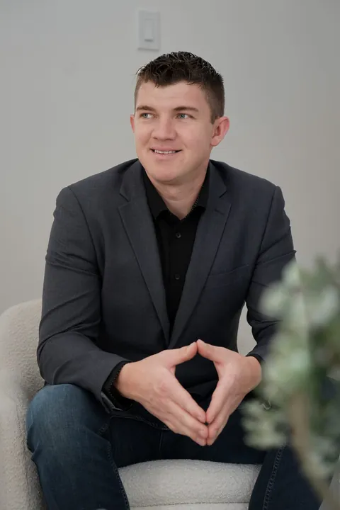 Abe Thiessen, seated in a bright office, glancing to the side